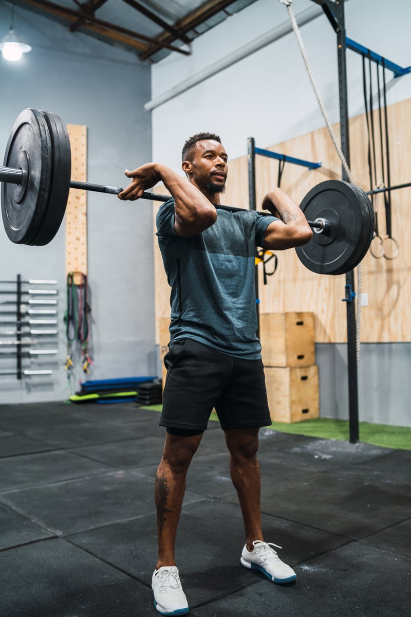 Crossfit Athlete Doing Exercise with a Barbell